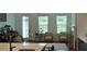 Bright living room features large windows, comfortable seating, and a decorative rug at 2962 Girard Ln, Duluth, GA 30097