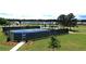 Community tennis courts surrounded by lush greenery, offering recreational opportunities for residents at 2962 Girard Ln, Duluth, GA 30097