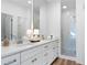 Bright bathroom with double sink vanity, white cabinets, and glass shower at 4856 Allatoona Gtwy # 8, Acworth, GA 30101