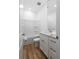 This bathroom has light colored walls, wood flooring, a bathtub, and vanity at 4856 Allatoona Gtwy # 8, Acworth, GA 30101