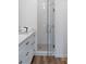 Bright bathroom with glass shower featuring white tiled walls at 4856 Allatoona Gtwy # 8, Acworth, GA 30101