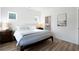 Bright bedroom with white walls and wood floor, next to bathroom entrance at 4856 Allatoona Gtwy # 8, Acworth, GA 30101