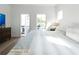 Bright bedroom with white walls, wood floor, and access to a private balcony at 4856 Allatoona Gtwy # 8, Acworth, GA 30101
