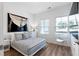 Bedroom features wood floors, large window, and decorative painting at 4856 Allatoona Gtwy # 8, Acworth, GA 30101