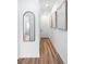 Hallway features wood flooring, white walls, and framed posters at 4856 Allatoona Gtwy # 8, Acworth, GA 30101