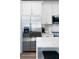 Close up of a modern kitchen with stainless steel appliances, white cabinets, and a quartz countertop at 4856 Allatoona Gtwy # 8, Acworth, GA 30101