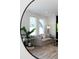 Living room view through mirror showcasing a couch and large windows at 4856 Allatoona Gtwy # 8, Acworth, GA 30101