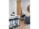 Stylish living space with bar seating, a wooden accent wall, and a comfortable office area at 4856 Allatoona Gtwy # 8, Acworth, GA 30101