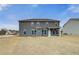 Exterior of home featuring a level backyard and covered patio at 512 Dolce Rd, Locust Grove, GA 30248
