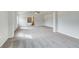 A spacious carpeted bedroom with views of a soaker tub and walk-in shower at 512 Dolce Rd, Locust Grove, GA 30248