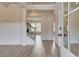 Inviting entryway features wood floors, staircase with metal spindles, and paneled walls at 512 Dolce Rd, Locust Grove, GA 30248