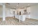 Modern kitchen with white cabinets, island, and stainless appliances at 512 Dolce Rd, Locust Grove, GA 30248