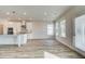 Bright kitchen with stainless appliances, island, and exterior access at 512 Dolce Rd, Locust Grove, GA 30248