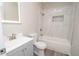 This bright bathroom features updated fixtures, large tub, and gray vanity at 1889 Vesta Ave, Atlanta, GA 30344