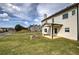 Spacious backyard featuring a stone fire pit and covered patio, ideal for outdoor entertaining at 200 Eva Way Ne, Cartersville, GA 30121