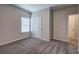 Neutral bedroom featuring gray carpet, white walls and a window with blinds at 200 Eva Way Ne, Cartersville, GA 30121