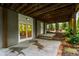 An outdoor patio features stone pavers, brick trim, and access to the home's interior at 318 5Th Ne St, Atlanta, GA 30308