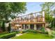 An expansive backyard featuring artificial turf and a spacious deck with curtains at 318 5Th Ne St, Atlanta, GA 30308