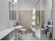 Bathroom featuring dual vanities, a shower-tub combination, and ample storage space at 318 5Th Ne St, Atlanta, GA 30308