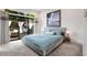 Relax in this spacious bedroom with a plush bed and access to a tranquil outdoor space through large sliding glass doors at 318 5Th Ne St, Atlanta, GA 30308