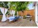 Outdoor deck with seating, grill, and heater, ideal for outdoor enjoyment at 318 5Th Ne St, Atlanta, GA 30308