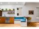 Eat in kitchen with breakfast nook, floating shelves and stainless steel dishwasher at 318 5Th Ne St, Atlanta, GA 30308