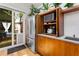 Open cabinetry with microwave, toaster oven and stainless steel refrigerator at 318 5Th Ne St, Atlanta, GA 30308