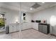Kitchenette with white cabinets, stainless steel appliances, and tile flooring at 318 5Th Ne St, Atlanta, GA 30308