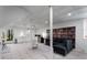 Bright living area with a large sofa and a decorative bookshelf wall design at 318 5Th Ne St, Atlanta, GA 30308