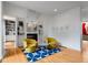 Chic living room featuring a cozy fireplace, modern art, hardwood floors, and two comfortable armchairs at 318 5Th Ne St, Atlanta, GA 30308