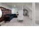 Comfortable living area featuring a large sofa, a decorative bookshelf, and tile floors at 318 5Th Ne St, Atlanta, GA 30308