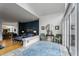 Spacious living room with hardwood floors, natural light, blue accent wall, and an inviting atmosphere at 318 5Th Ne St, Atlanta, GA 30308