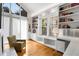Bright office space featuring custom built-ins, natural light, and a comfortable seating area at 318 5Th Ne St, Atlanta, GA 30308