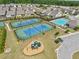 Overhead aerial showcasing community tennis courts, swimming pool, playground, and neighborhood in a landscaped setting at 3382 Long Creek Dr, Buford, GA 30519