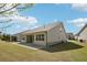 Backyard featuring a concrete patio and a well-maintained lawn at 3382 Long Creek Dr, Buford, GA 30519