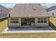 A view of the backyard with a concrete patio, perfect for entertaining or relaxation at 3382 Long Creek Dr, Buford, GA 30519