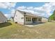 Backyard featuring a concrete patio and a well-maintained lawn at 3382 Long Creek Dr, Buford, GA 30519
