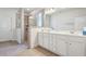 Bathroom with double sink vanity, large mirror, and a separate tiled shower area at 3382 Long Creek Dr, Buford, GA 30519