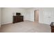 Neutral bedroom with dresser, television, and closet space, ready for personalization and relaxation at 3382 Long Creek Dr, Buford, GA 30519