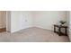 Bright bedroom with neutral carpet, adjacent doors, and small side table at 3382 Long Creek Dr, Buford, GA 30519