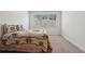 Bedroom featuring a floral-patterned bedspread with a window providing natural light at 3382 Long Creek Dr, Buford, GA 30519