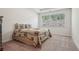 Bedroom featuring a floral-patterned bedspread with a window providing natural light at 3382 Long Creek Dr, Buford, GA 30519