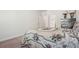 Bedroom featuring a floral-patterned bedspread and a dresser wrapped for protection at 3382 Long Creek Dr, Buford, GA 30519
