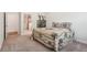 Bedroom featuring a floral-patterned bedspread, dresser, and doorway to another room at 3382 Long Creek Dr, Buford, GA 30519