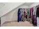 Walk-in closet with ample hanging space and angled ceiling at 3382 Long Creek Dr, Buford, GA 30519