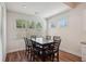 Light-filled dining area showcases a dining table for six, surrounded by large windows with natural views at 3382 Long Creek Dr, Buford, GA 30519