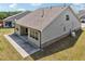 A lovely exterior angle of the home with a large concrete patio area, offering a nice outdoor area at 3382 Long Creek Dr, Buford, GA 30519