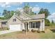 Charming single-story home with a brick facade, well-manicured lawn, and attached garage at 3382 Long Creek Dr, Buford, GA 30519