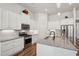 Stylish kitchen with granite countertops, stainless steel appliances, ample cabinet space, and a functional center island at 3382 Long Creek Dr, Buford, GA 30519