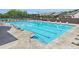 Exterior view of a large rectangular pool with lounge chairs and landscaping, providing an inviting recreational space at 3382 Long Creek Dr, Buford, GA 30519
